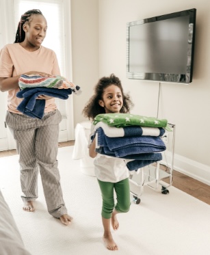 Parent helping with towels